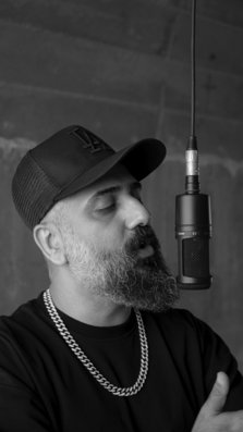A man raps into a microphone
